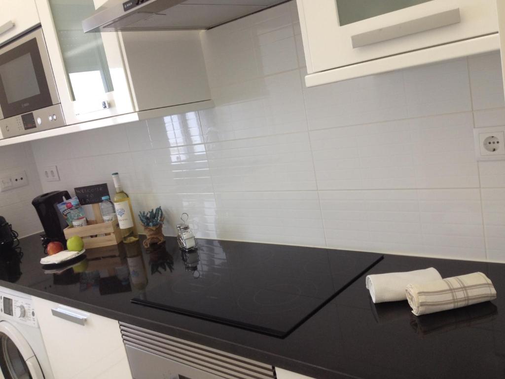 Kuchyň nebo kuchyňský kout v ubytování Cândido Reis Apartments