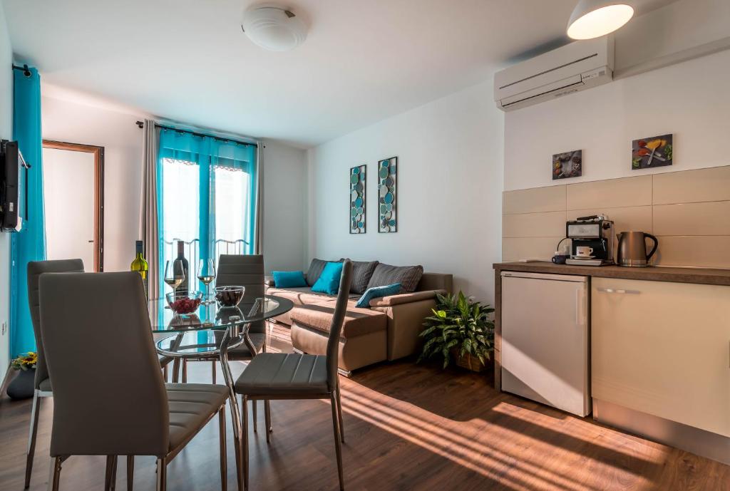 a living room with a couch and a table at City market apartments Pula in Pula