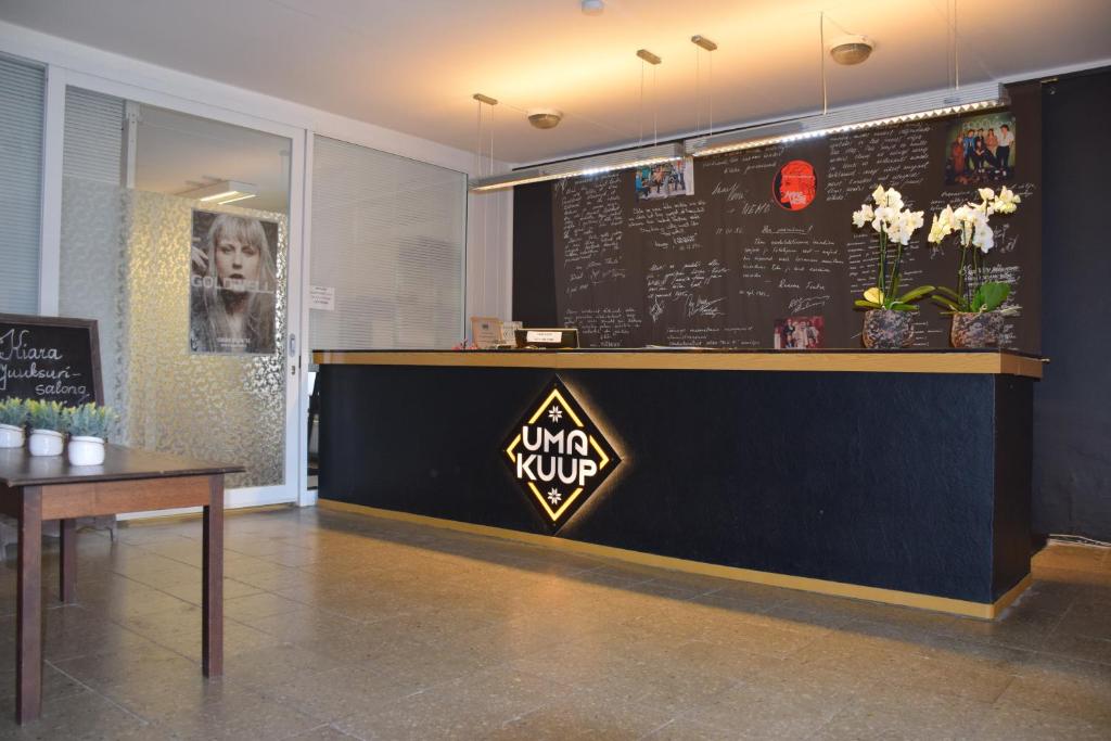 a restaurant with a counter with a sign on it at Uma Kuup Guest Apartments in Võru