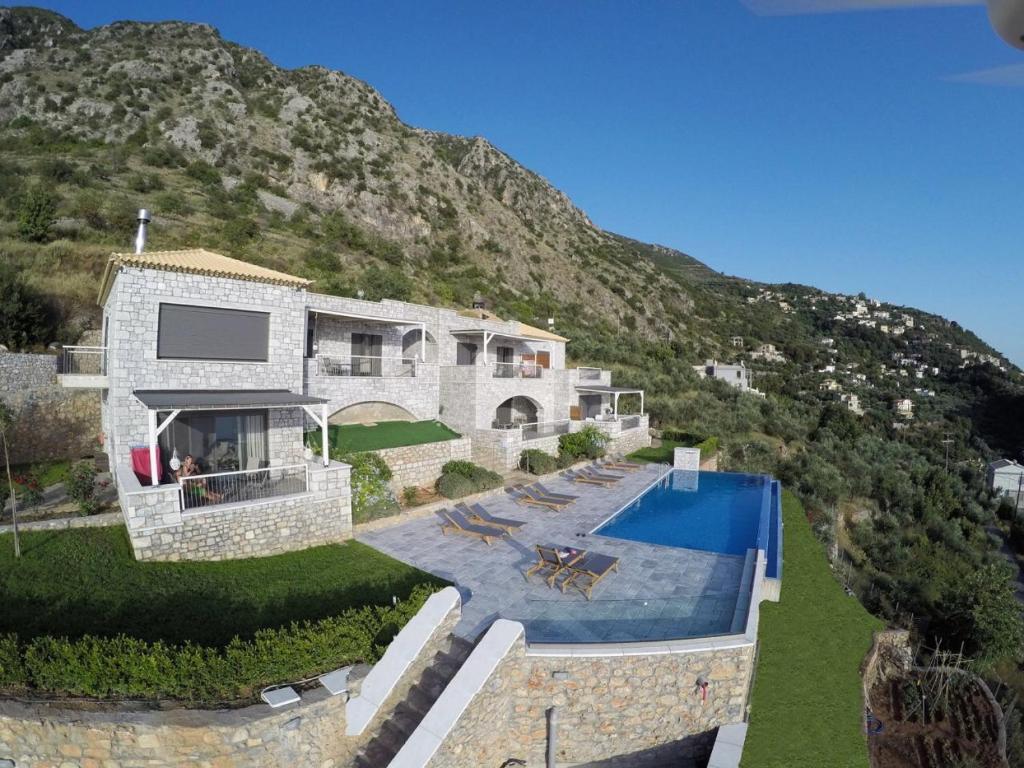 an aerial view of a house with a swimming pool at Petra Thea in Kalamata