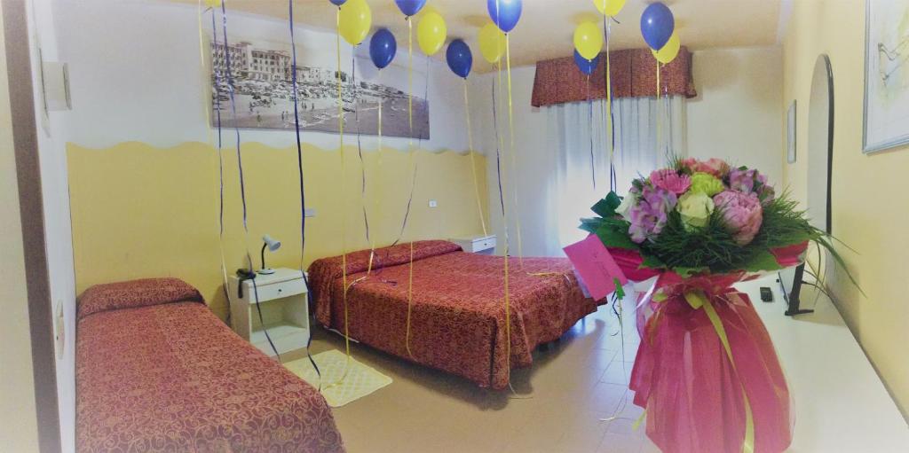 Postel nebo postele na pokoji v ubytování Hotel Al Mare