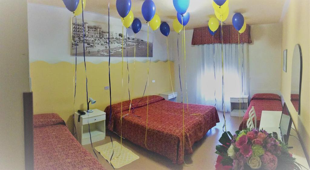 Postel nebo postele na pokoji v ubytování Hotel Al Mare