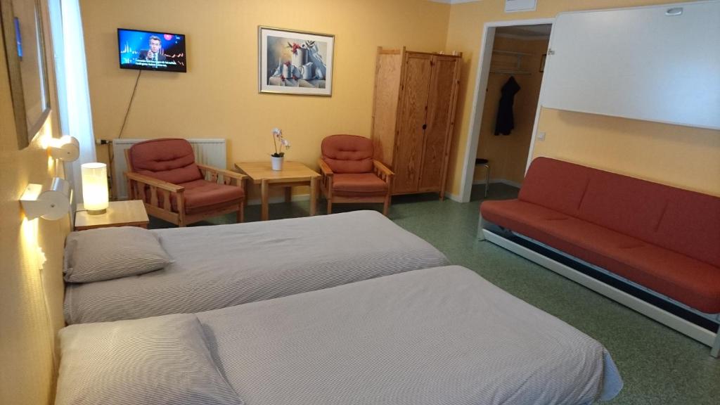 TV a/nebo společenská místnost v ubytování Bollegården B&B