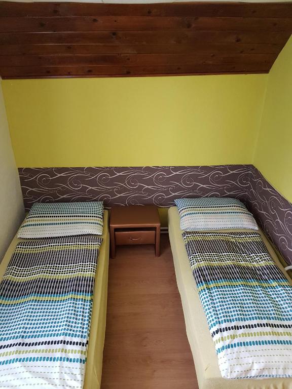 Posteľ alebo postele v izbe v ubytovaní Vila Valéria