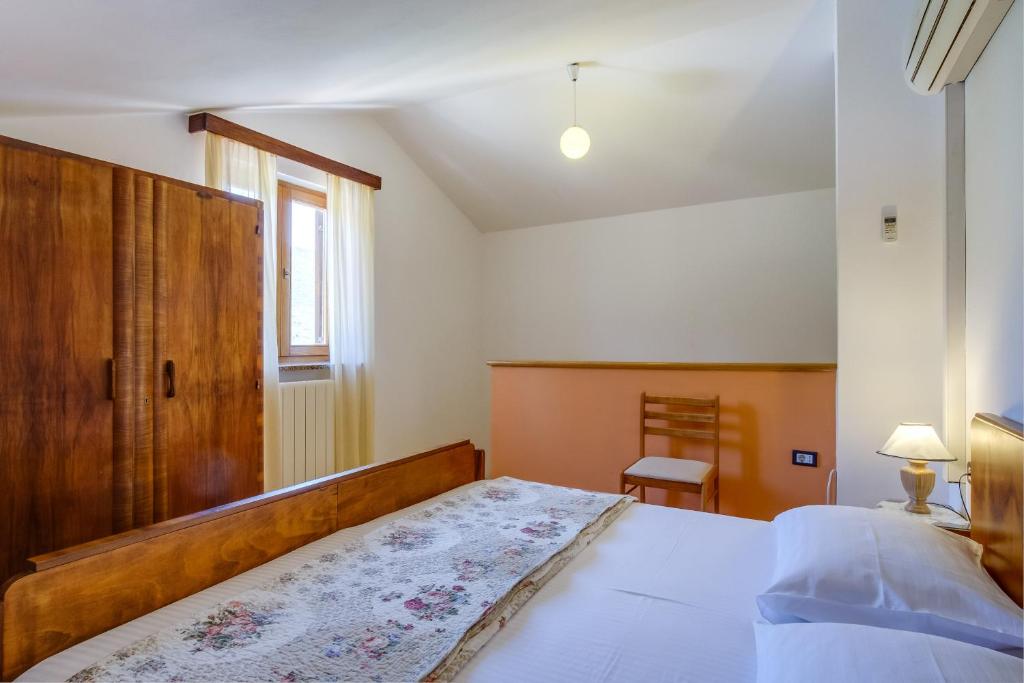 Postel nebo postele na pokoji v ubytování Apartmani Zorica