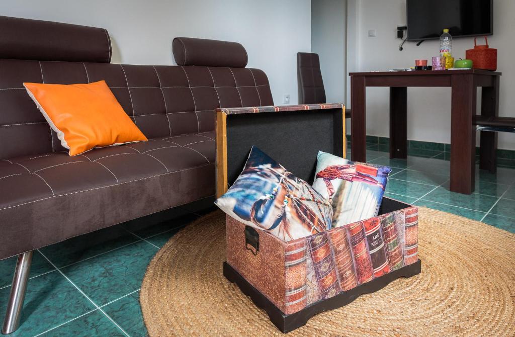 a living room with a couch and a box with pillows at "NM" Luxury apartments in Split