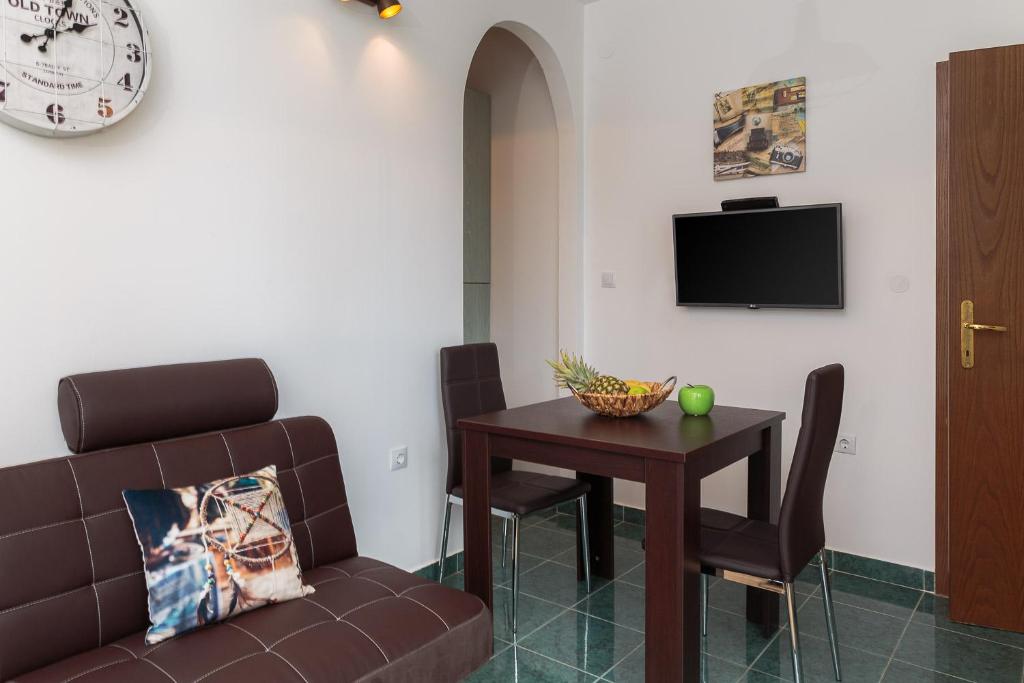 a living room with a couch and a table at "NM" Luxury apartments in Split
