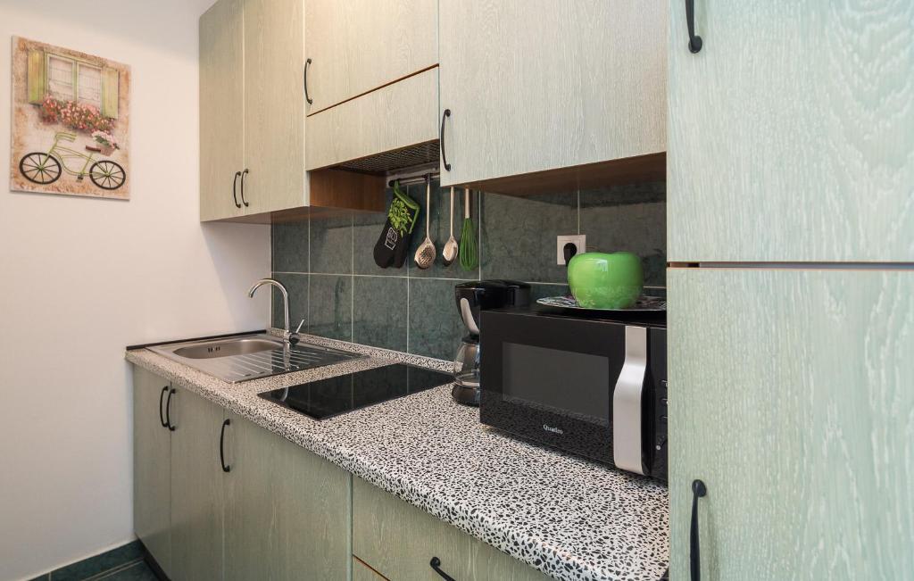 a kitchen with a sink and a microwave at "NM" Luxury apartments in Split