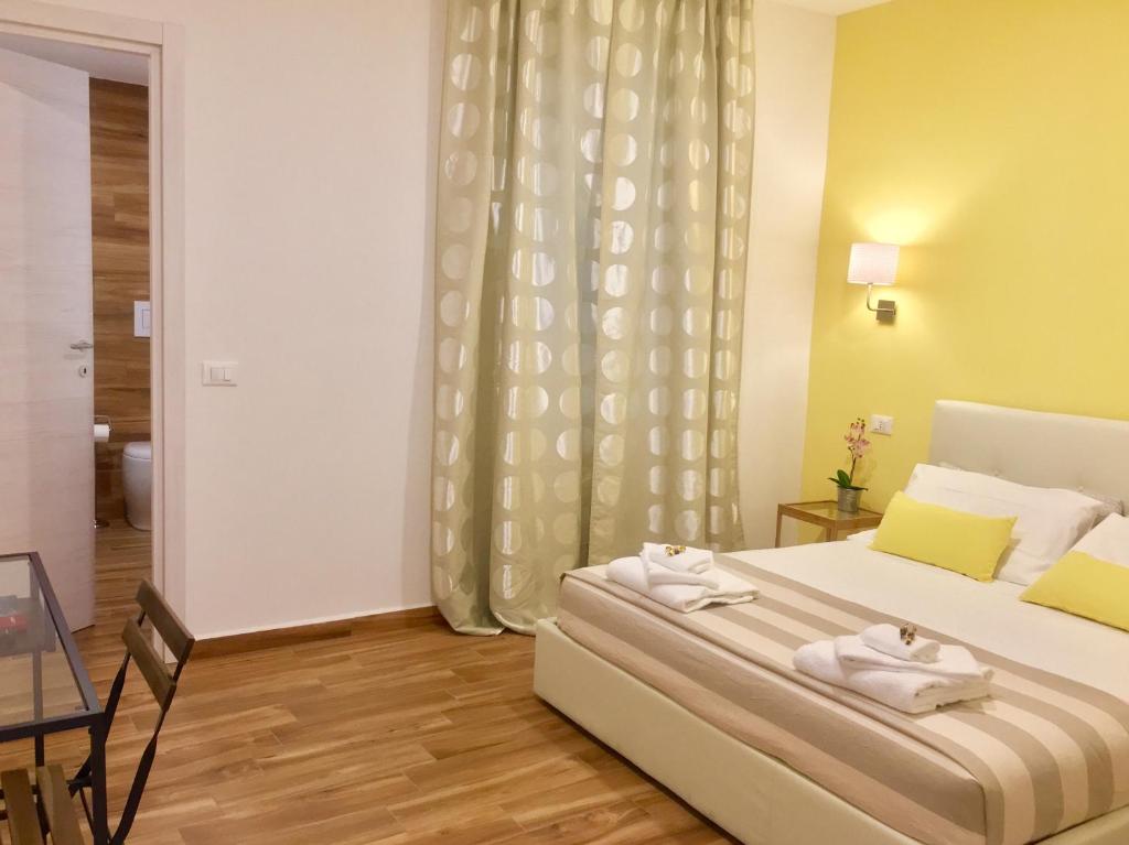 Postel nebo postele na pokoji v ubytování Cavallotti 21