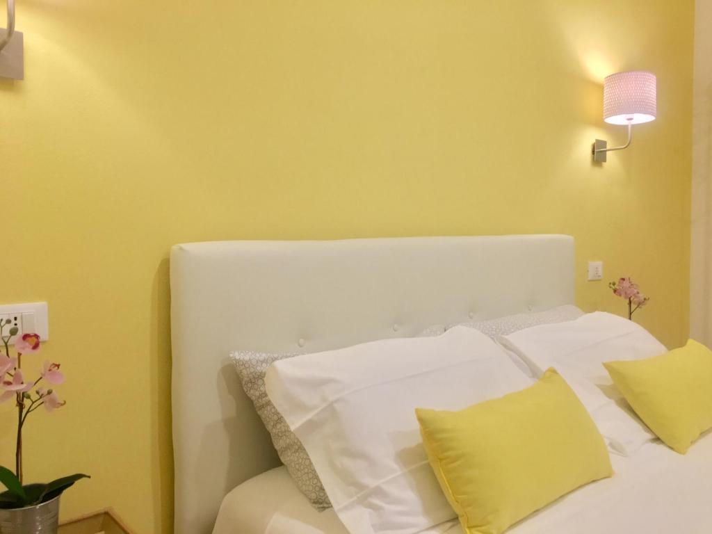 Postel nebo postele na pokoji v ubytování Cavallotti 21