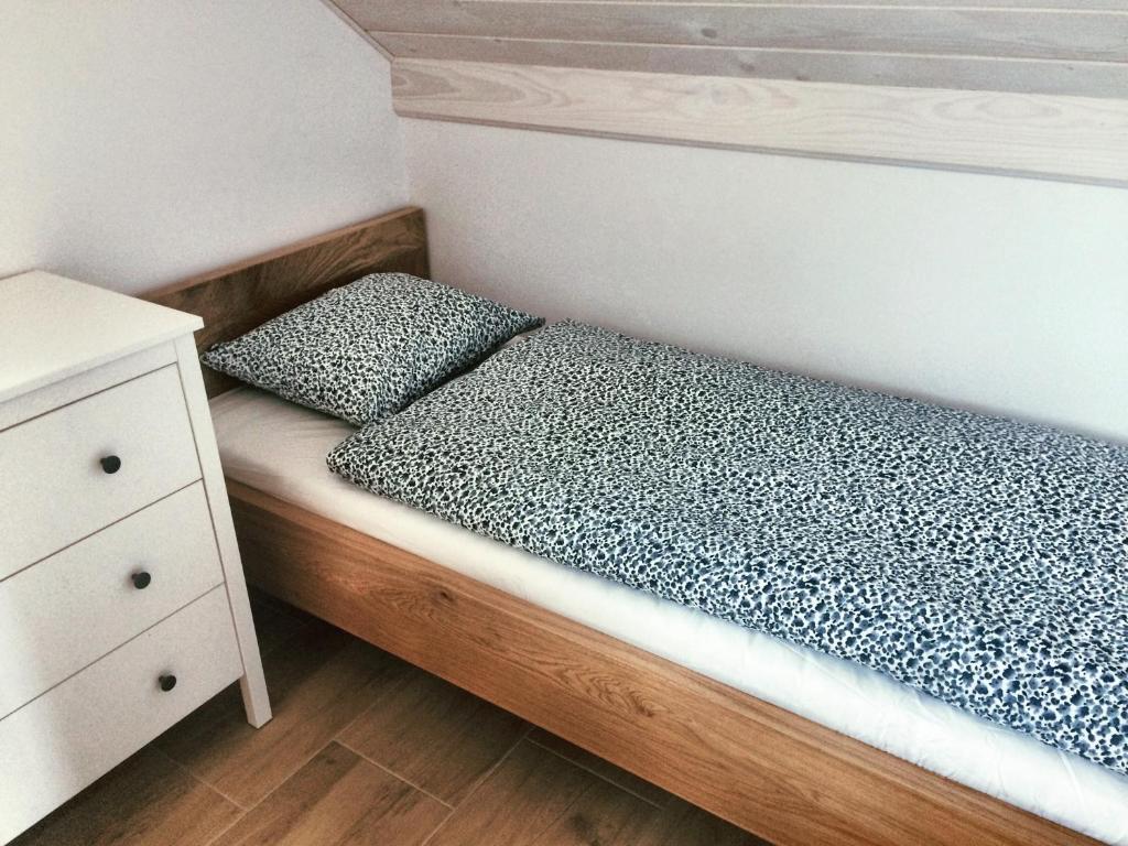 Postel nebo postele na pokoji v ubytování Domek na Siglanach