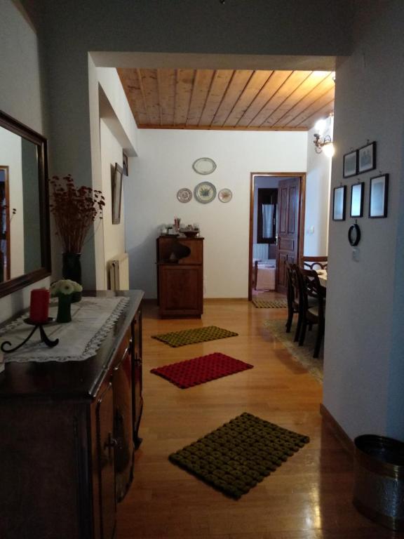 a kitchen and dining room with a refrigerator and a table at Village House in Agios Lavrentios