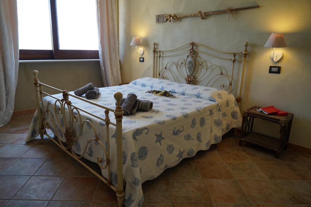 Postel nebo postele na pokoji v ubytování Masseria Le Terrazze di Serranova