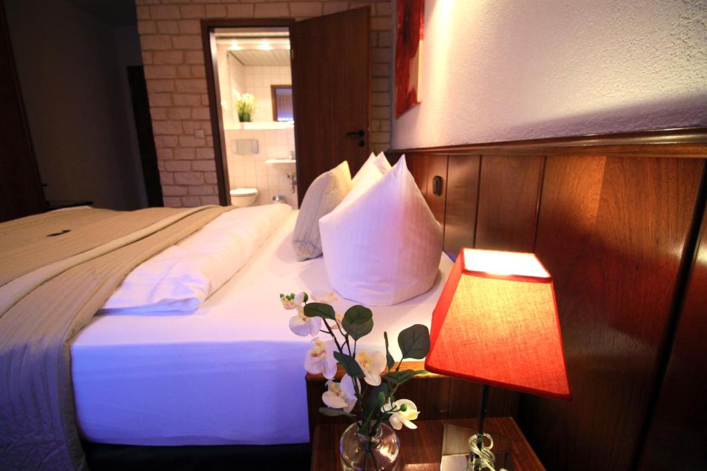 Voodi või voodid majutusasutuse Hotel "Am Fischhof" toas
