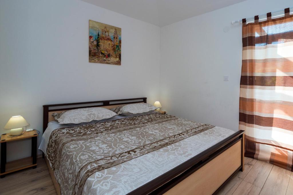 Posteľ alebo postele v izbe v ubytovaní Apartments Intrada