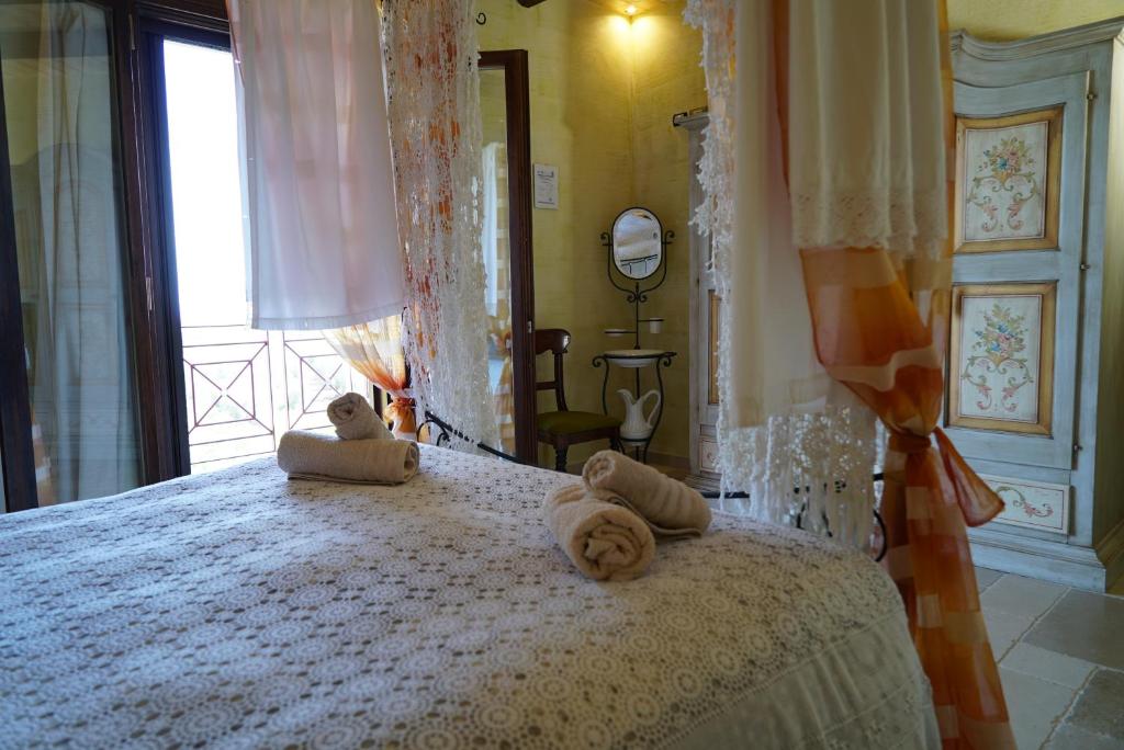 Postel nebo postele na pokoji v ubytování Masseria Le Terrazze di Serranova