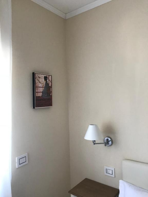Postel nebo postele na pokoji v ubytování L’OPERÀ