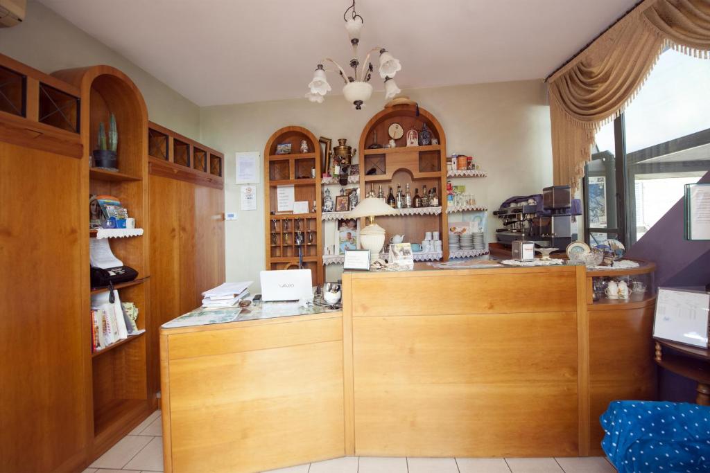 A kitchen or kitchenette at Hotel Athena