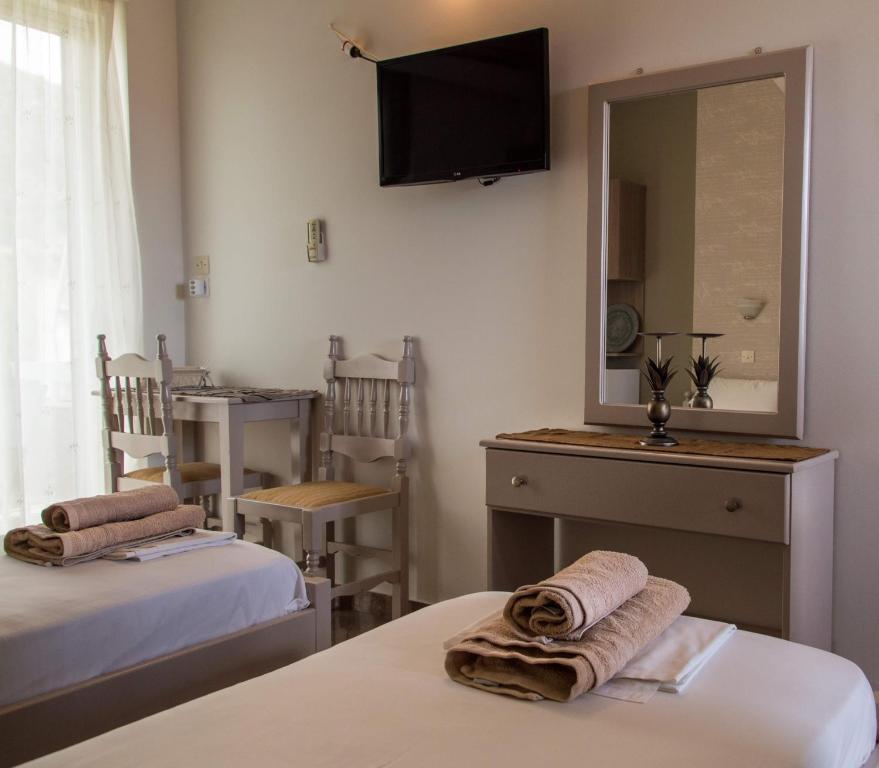 Postel nebo postele na pokoji v ubytování Maltezos Rooms