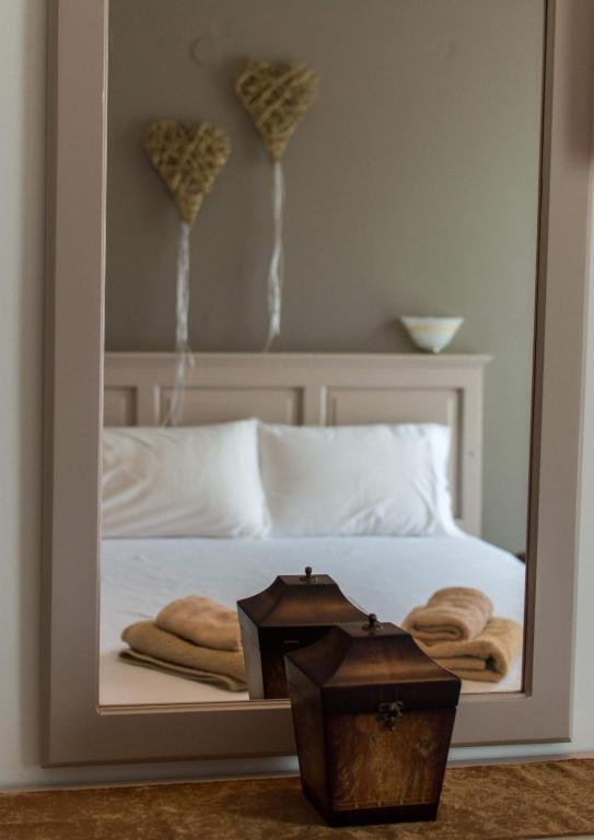 Postel nebo postele na pokoji v ubytování Maltezos Rooms