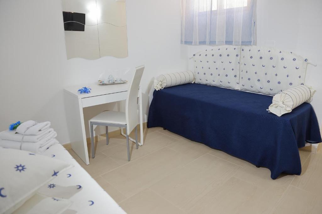 Posteľ alebo postele v izbe v ubytovaní B&B Il Melograno Antico con Terrazza e Giardino