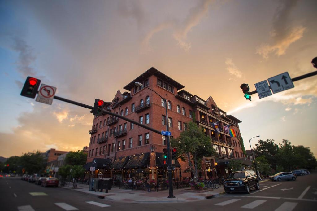 a large brick building on a city street with a traffic light at Hotel Boulderado in Boulder