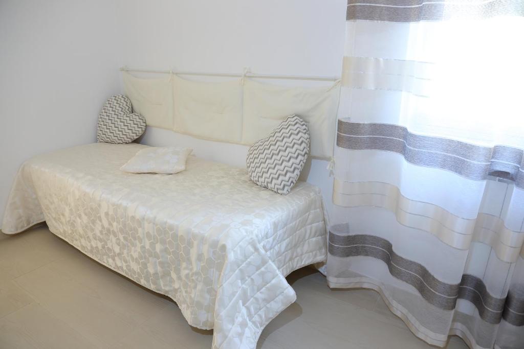 Posteľ alebo postele v izbe v ubytovaní B&B Il Melograno Antico con Terrazza e Giardino