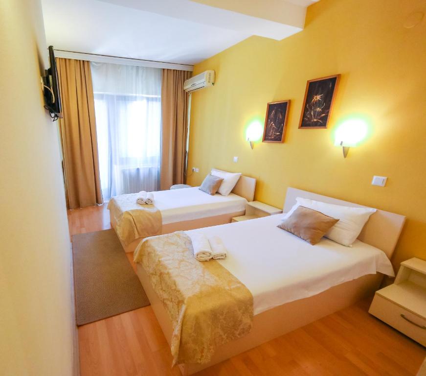 Postel nebo postele na pokoji v ubytování Hotel Pine