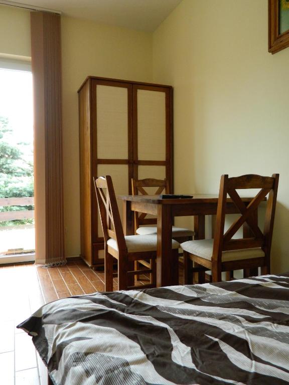 Postel nebo postele na pokoji v ubytování Dom Bartek