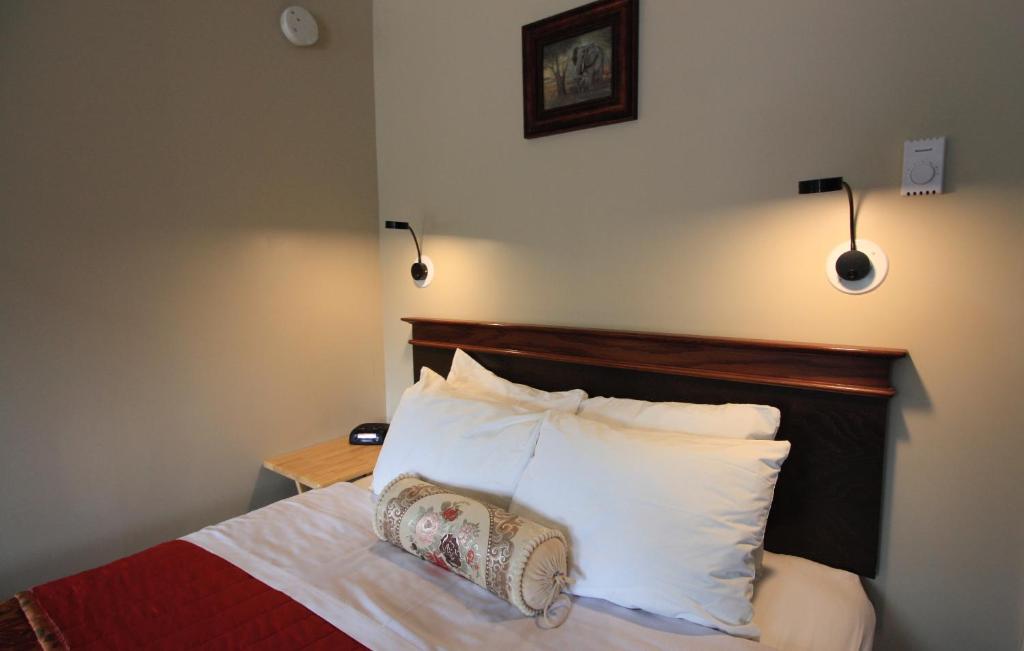 Postel nebo postele na pokoji v ubytování Motel Le JoliBourg