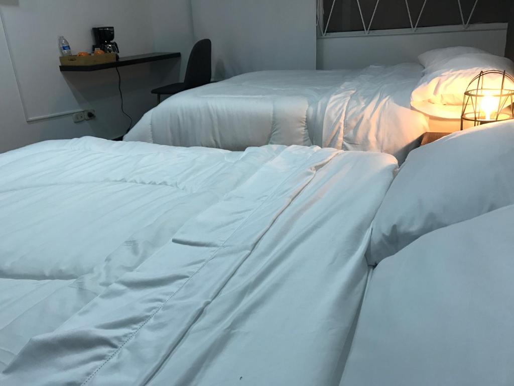 Postel nebo postele na pokoji v ubytování Hotel OrangeTrip