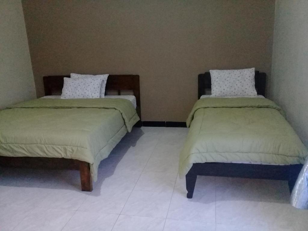 Postel nebo postele na pokoji v ubytování Cinnamon Guest House