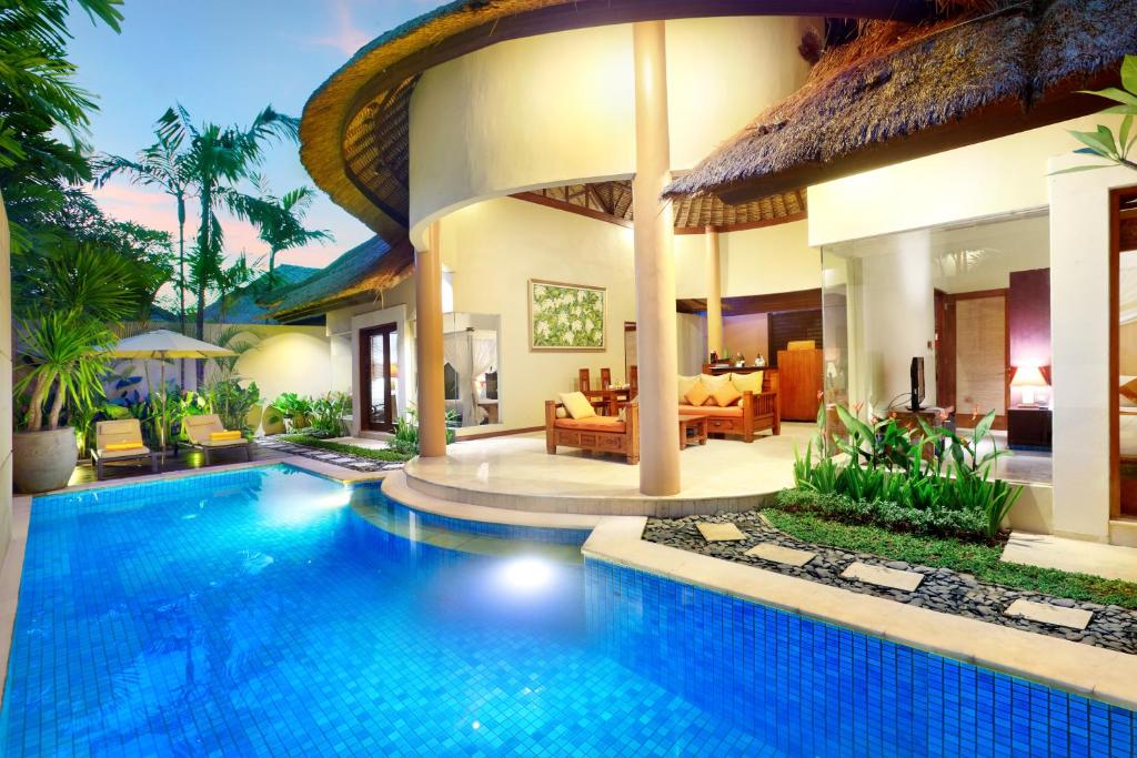 a villa with a swimming pool in a resort at Bhavana Private Villas in Seminyak