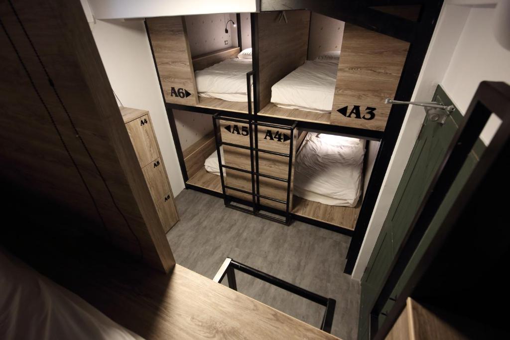 Postel nebo postele na pokoji v ubytování G.O.A.T Hostel