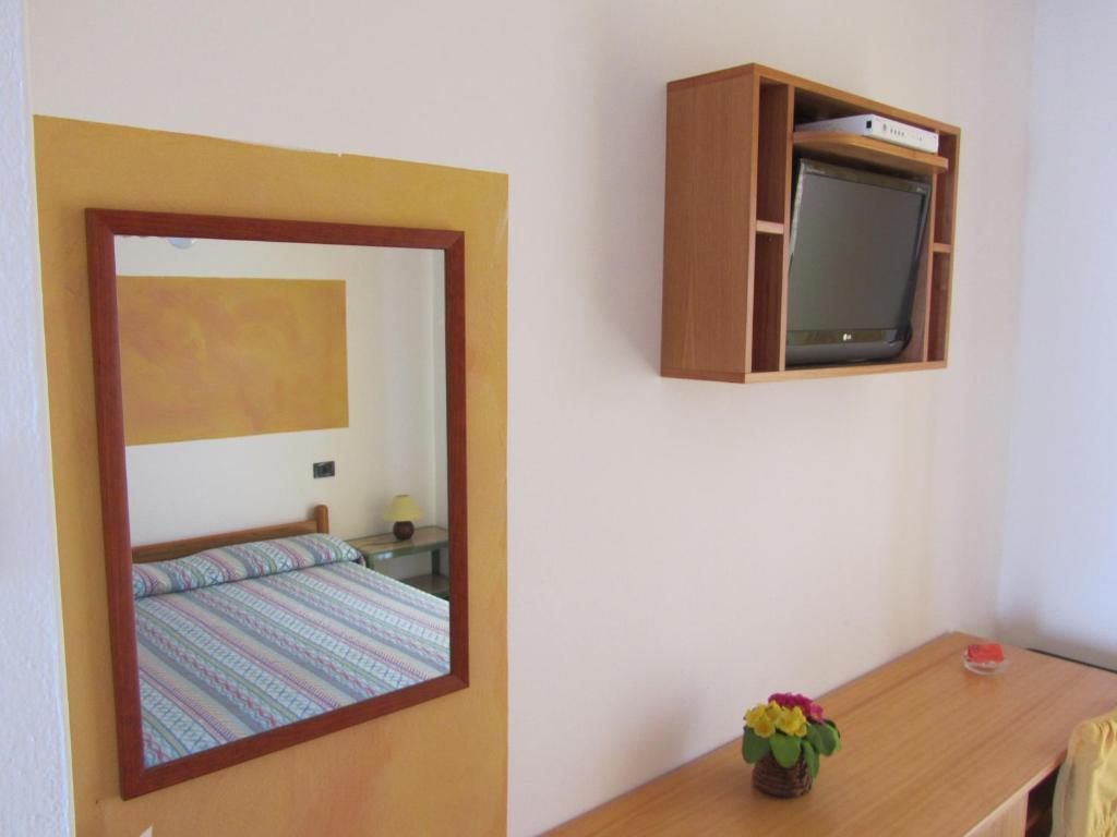 Postel nebo postele na pokoji v ubytování Hotel Silvestrino
