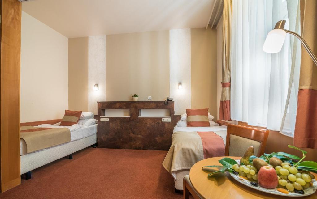 Łóżko lub łóżka w pokoju w obiekcie Hotel Spa Hévíz