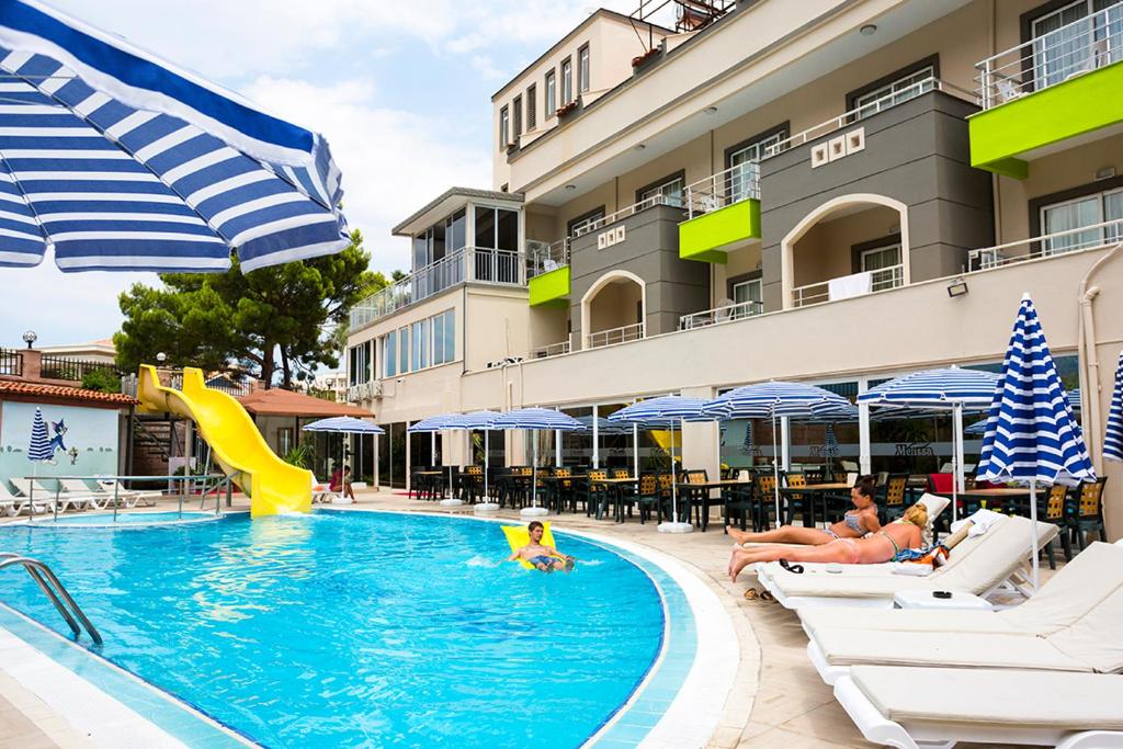 The swimming pool at or close to Rich Melissa Hotel
