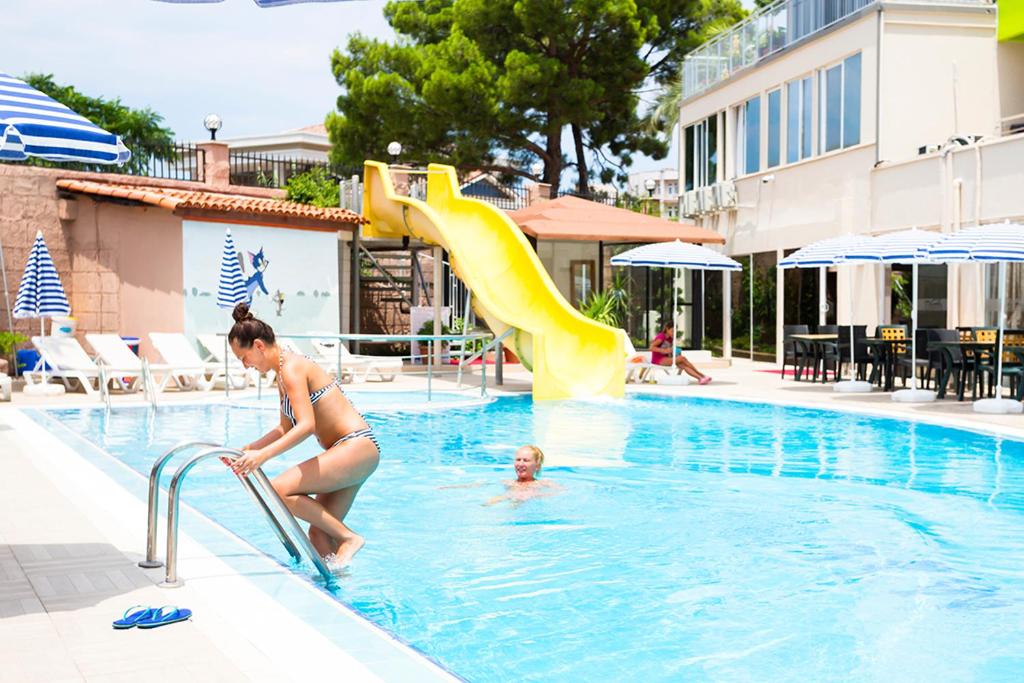 The swimming pool at or close to Rich Melissa Hotel