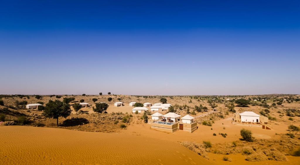 an aerial view of a resort in the desert at Dhora Desert Resort, Signature collection by Eight Continents in Shaitrāwa