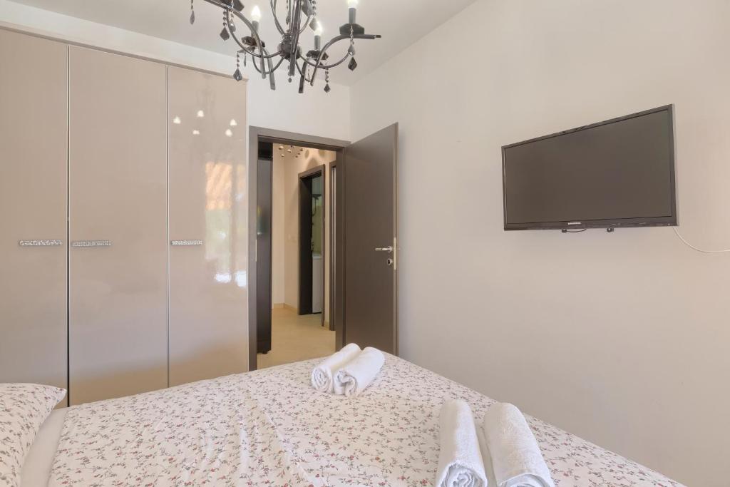 Łóżko lub łóżka w pokoju w obiekcie Apartment Robert