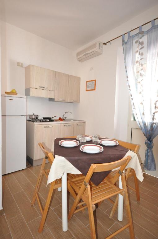 Kuchyň nebo kuchyňský kout v ubytování Villaggio Elisena