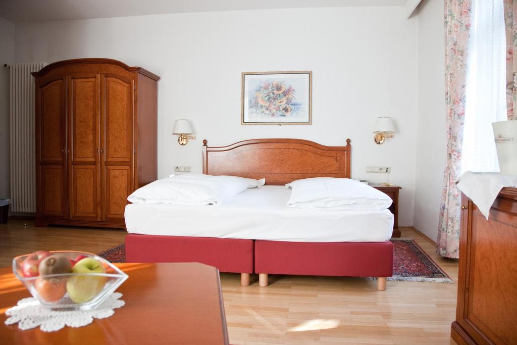 Postel nebo postele na pokoji v ubytování Residence Hotel Gasser