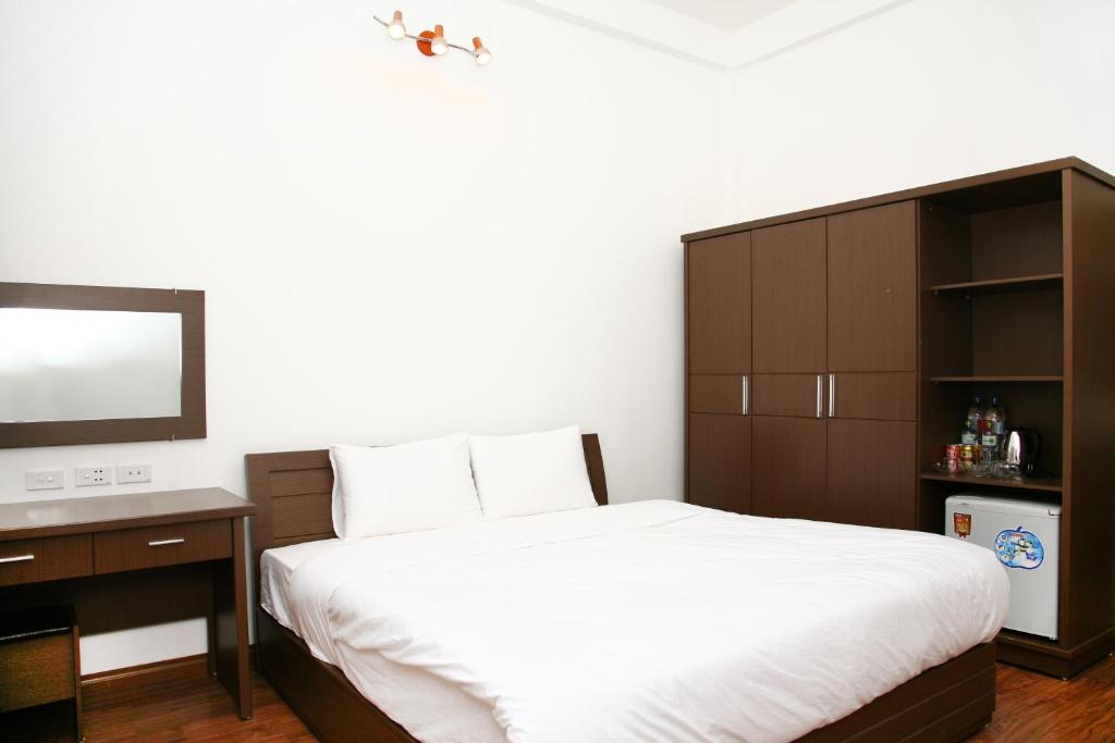 Postel nebo postele na pokoji v ubytování Bluebell Hotel