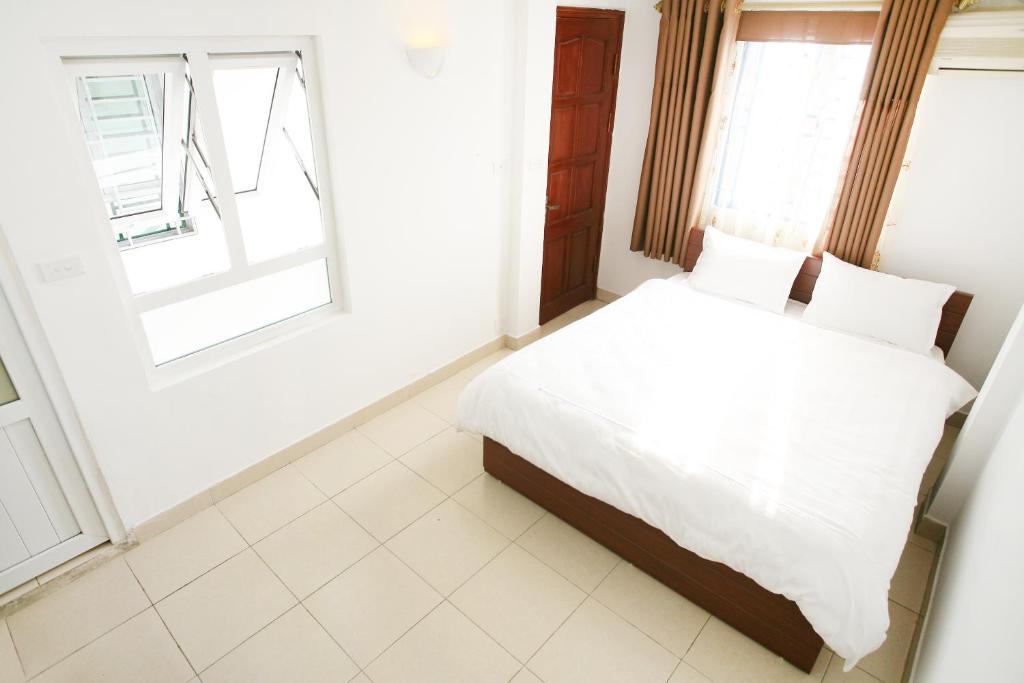 Postel nebo postele na pokoji v ubytování Bluebell Hotel