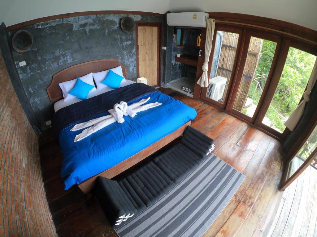 Postel nebo postele na pokoji v ubytování Blue Heaven Resort Koh Tao