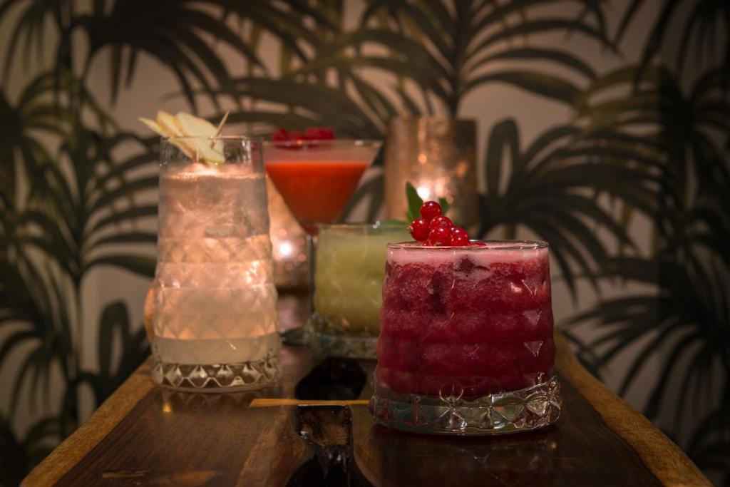 a group of different types of candles on a table at Hôtel La Bourdonnais by Inwood Hotels in Paris