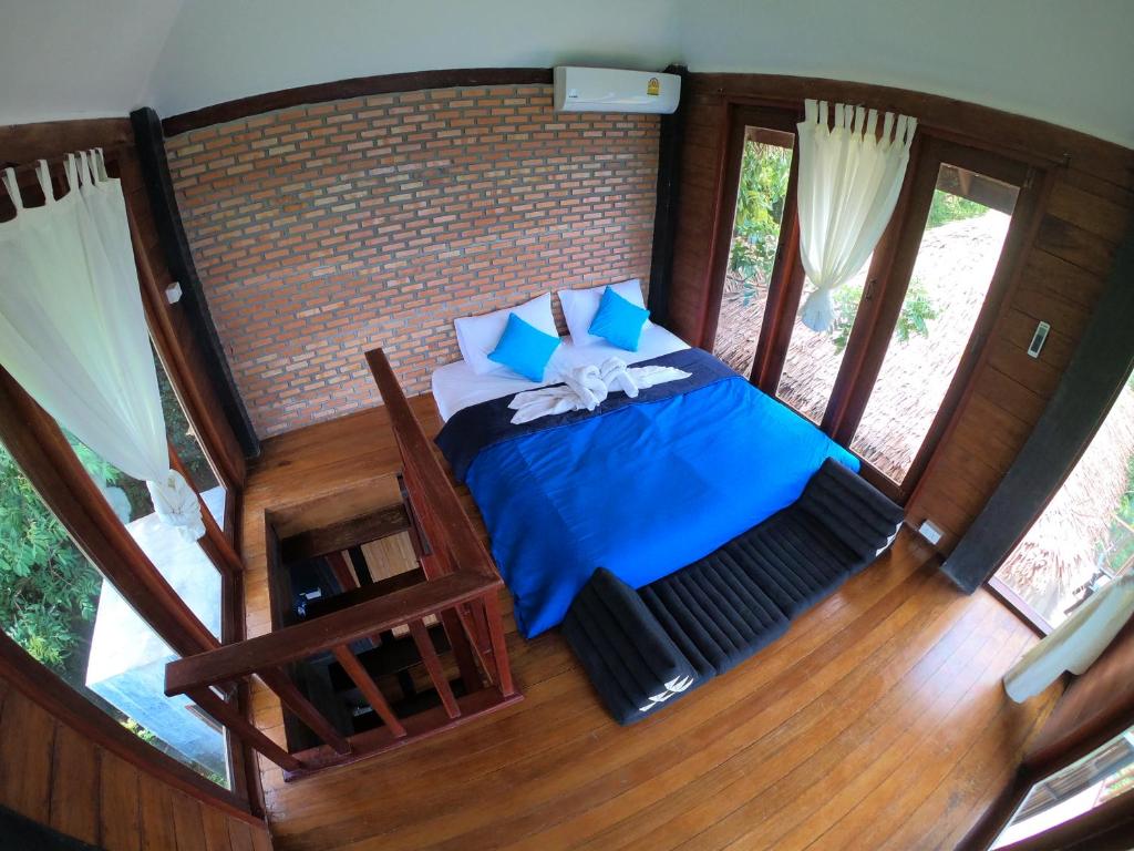 Postel nebo postele na pokoji v ubytování Blue Heaven Resort Koh Tao