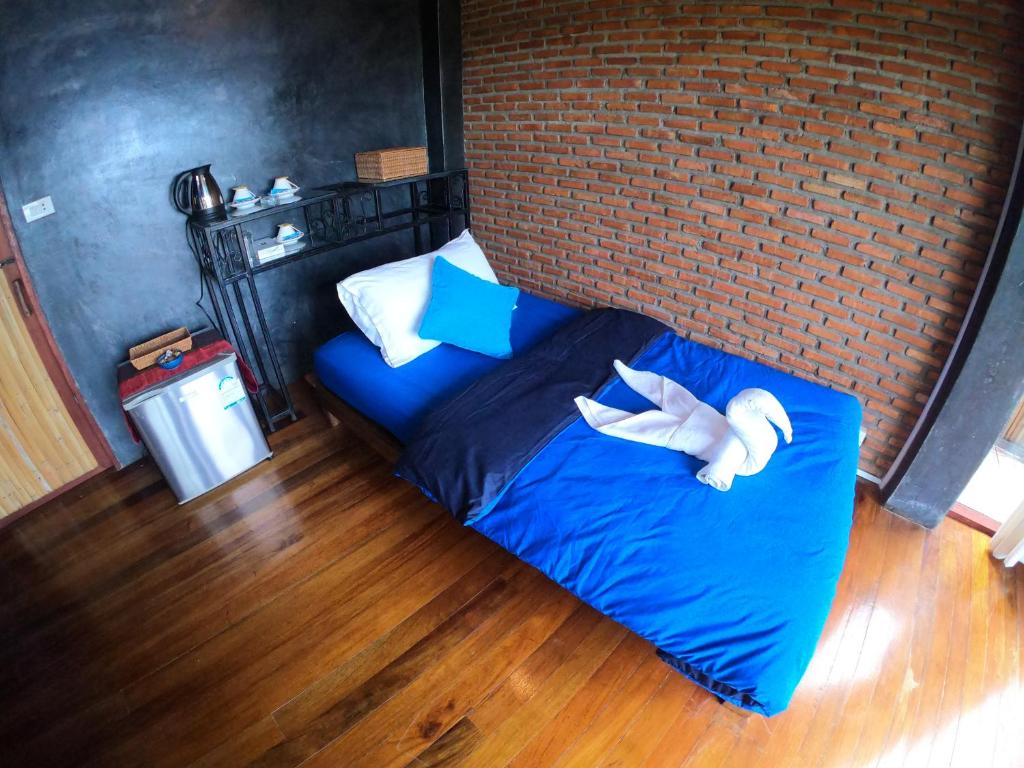 Postel nebo postele na pokoji v ubytování Blue Heaven Resort Koh Tao