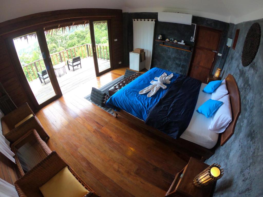 Postel nebo postele na pokoji v ubytování Blue Heaven Resort Koh Tao