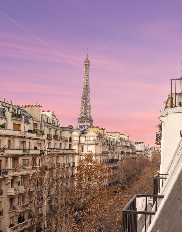 a view of the eiffel tower from a building at Hôtel La Bourdonnais by Inwood Hotels in Paris